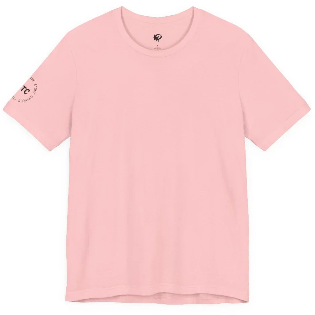 A light pink short-sleeve crewneck t-shirt with a small circular black graphic printed on the left sleeve, displayed flat against a solid white background.