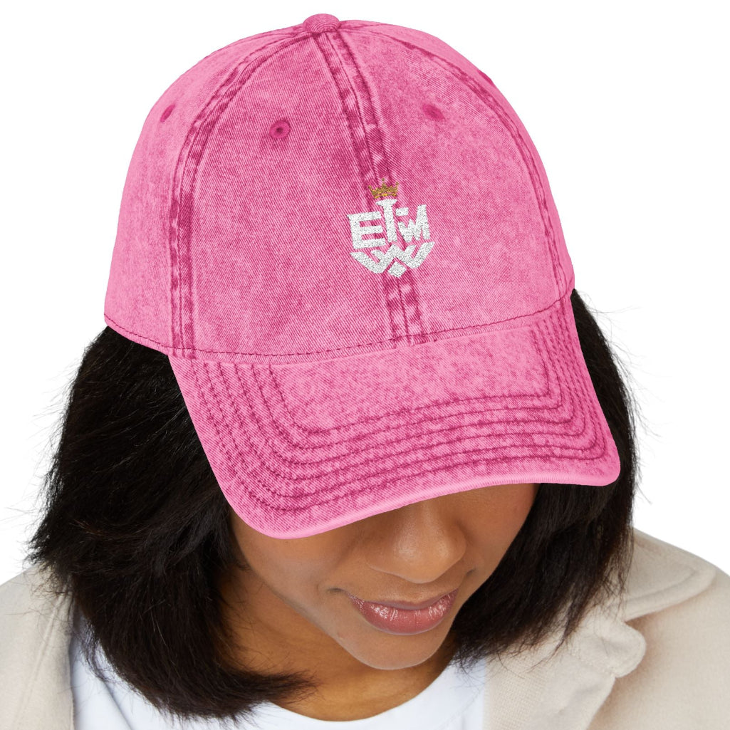 Person wearing a pink cap with text on a white background