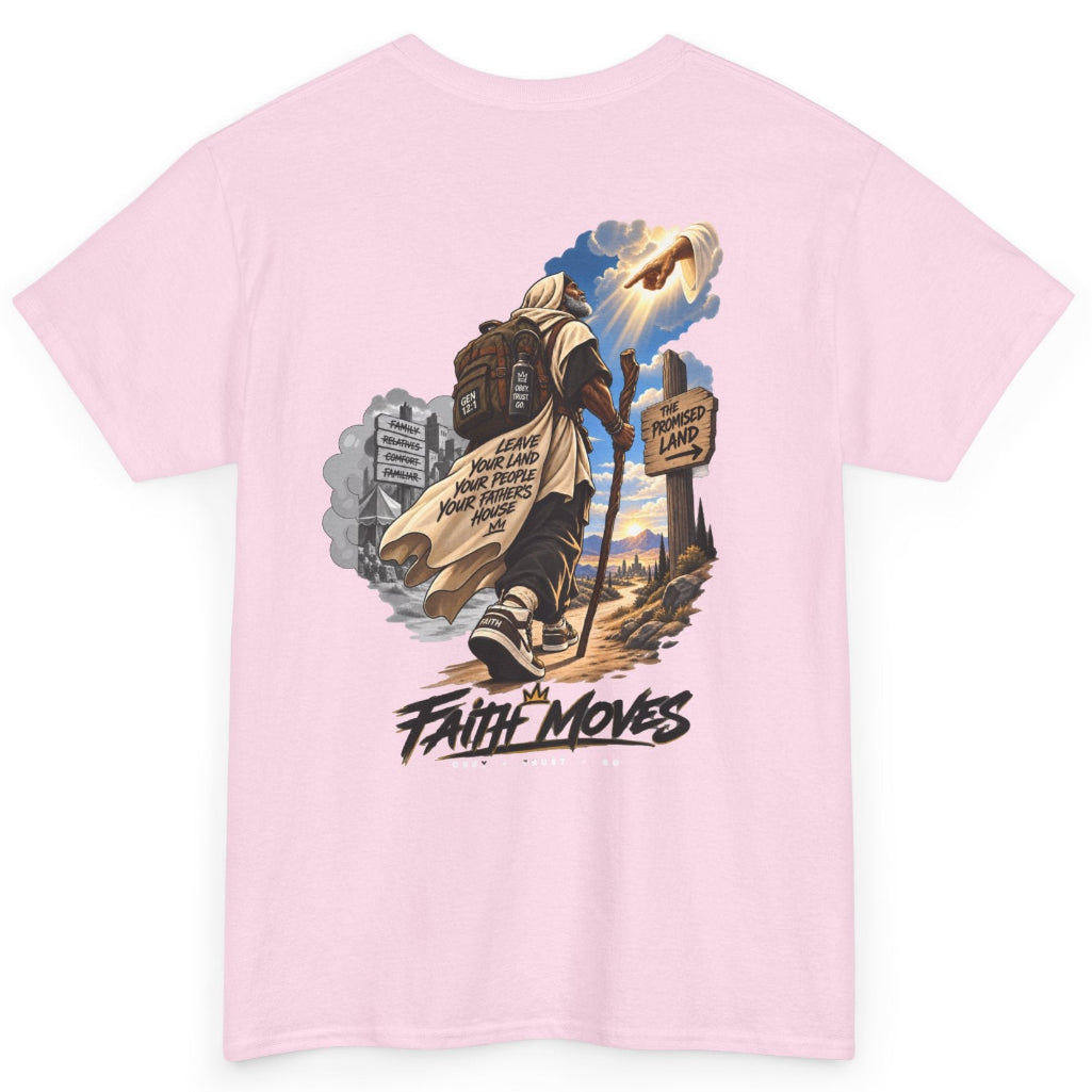 A light pink short-sleeve t-shirt with a large graphic print on the back. The graphic features a man carrying a large brown backpack, walking forward with a sign that reads 'FAITH MOVES' below it, set against a scenic background with a church building and a bright sky.