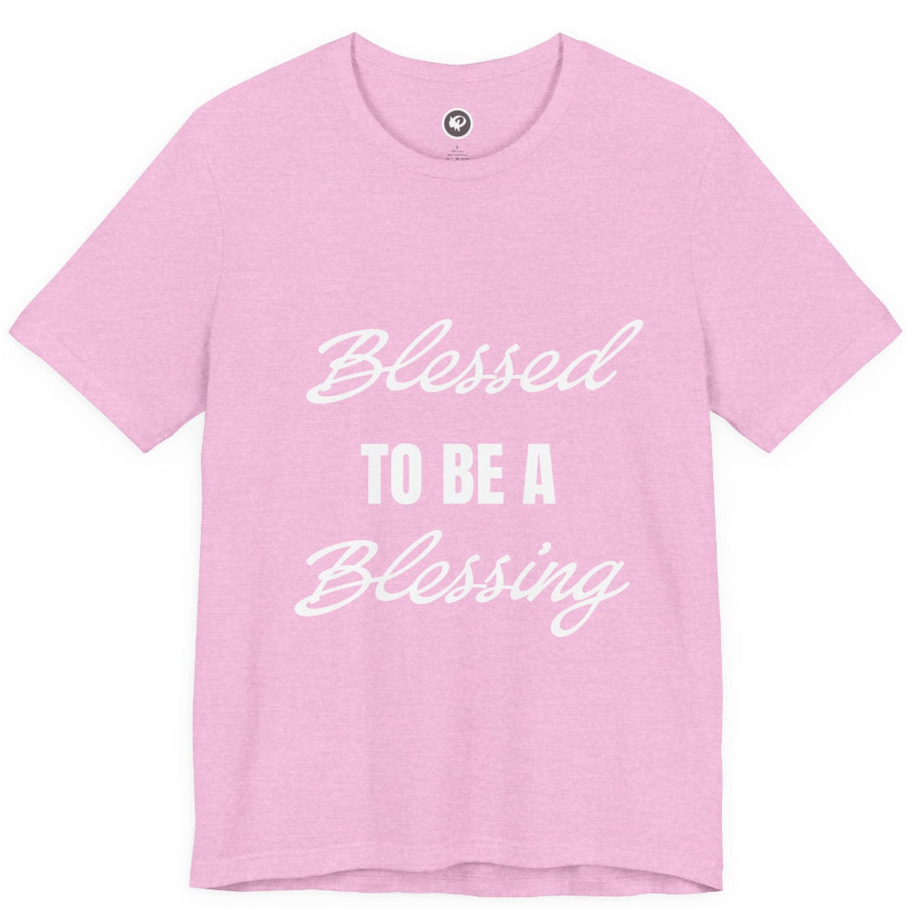 A light pink short-sleeve t-shirt with white text reading 'Blessed TO BE A Blessing' printed on the front, displayed against a solid white background.
