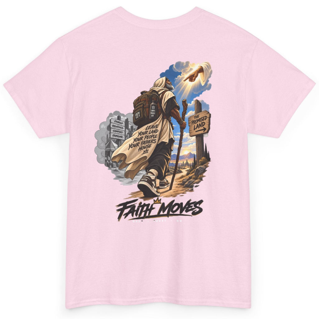 A light pink short-sleeve t-shirt with a large graphic print on the back. The graphic features a man carrying a large brown staff, walking forward with a sign that reads 'FAITH MOVES' below it, set against a scenic background with a church building and a bright sky.