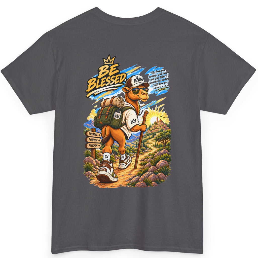 A dark gray crewneck t-shirt featuring a colorful graphic print of a cartoon camel wearing a hiking outfit and backpack, with the text 'BE BLESSED' and a mountain landscape background.