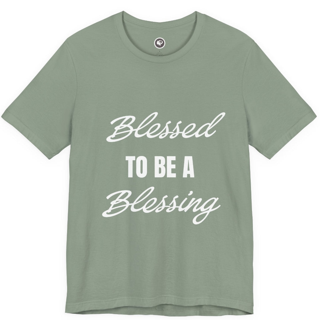 A sage green short-sleeve t-shirt with the phrase 'Blessed TO BE A Blessing' printed on the front in white script and block lettering, displayed against a solid white background.