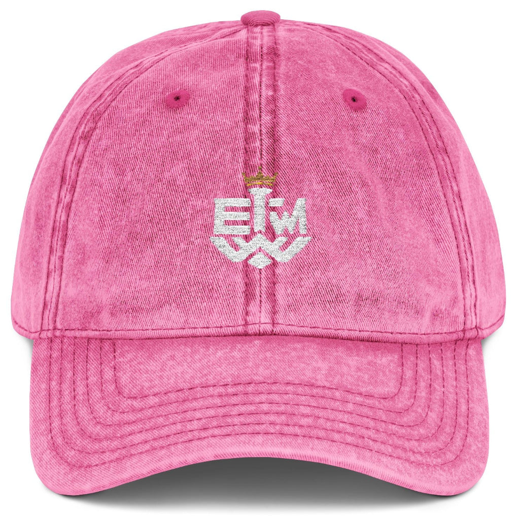 Pink cap with 'IEWM' embroidered on a white background