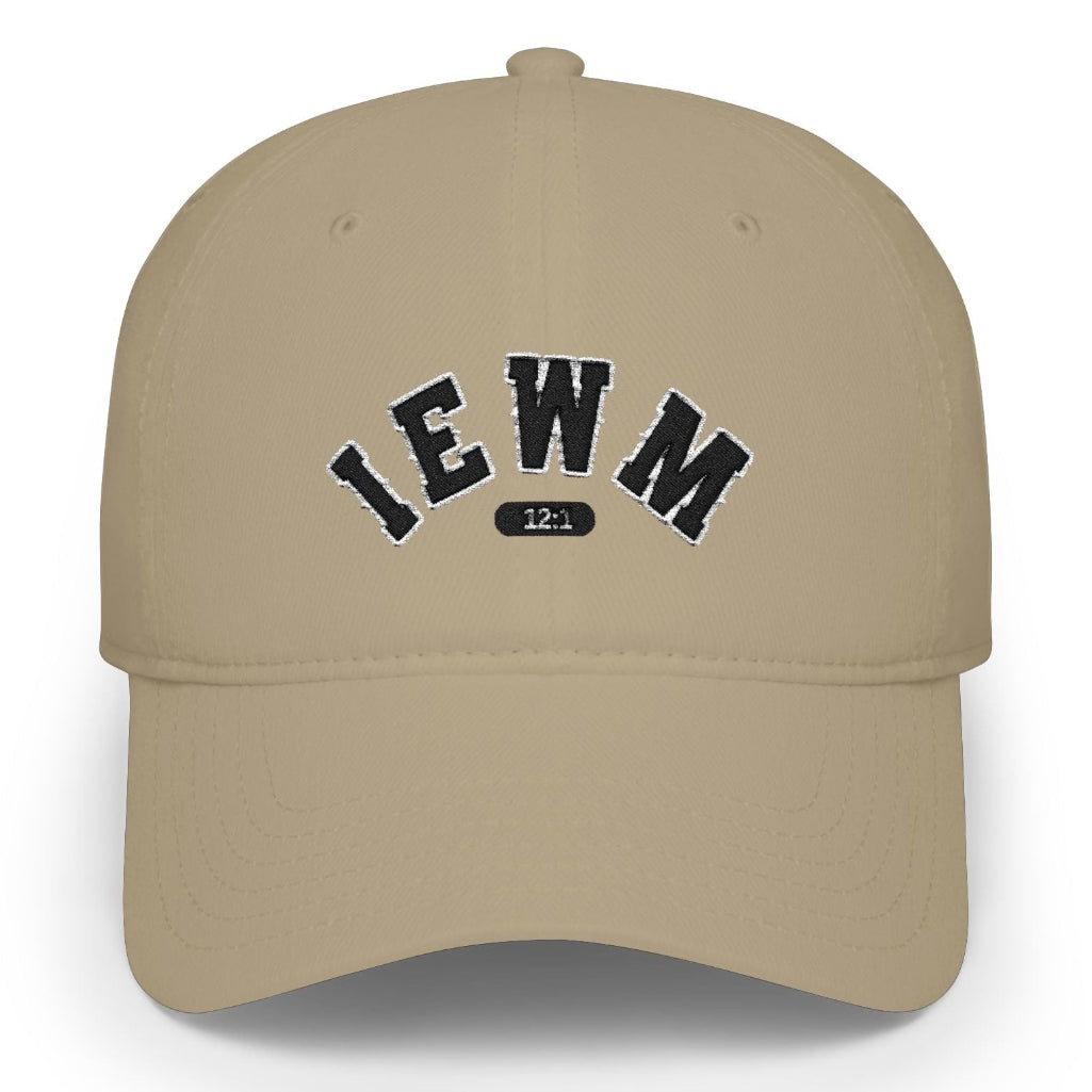 A khaki baseball cap with 'IEWM' and a small '12:1' emblem embroidered in black on the front, shown against a plain white background.