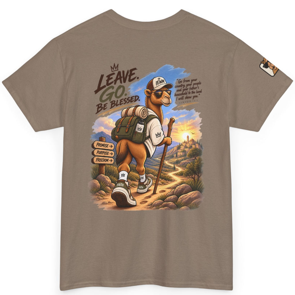 A taupe brown short-sleeve T-shirt with a large graphic print on the front showing a camel hiker with the text 'LEAVE. GO. BE BLESSED