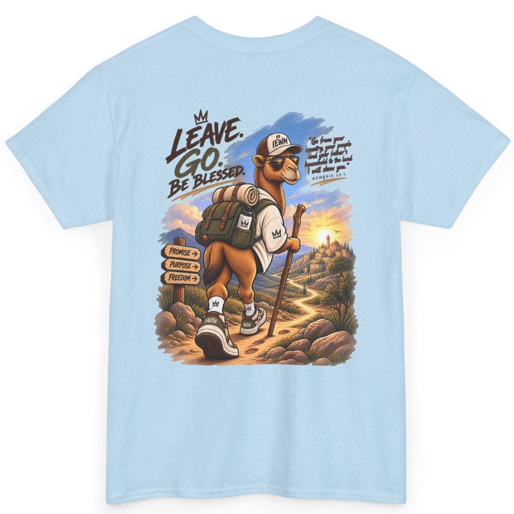 A light blue crewneck t-shirt featuring a large graphic print on the front. The graphic depicts a camel hiker carrying a backpack and walking stick, with the text 'LEAVE.