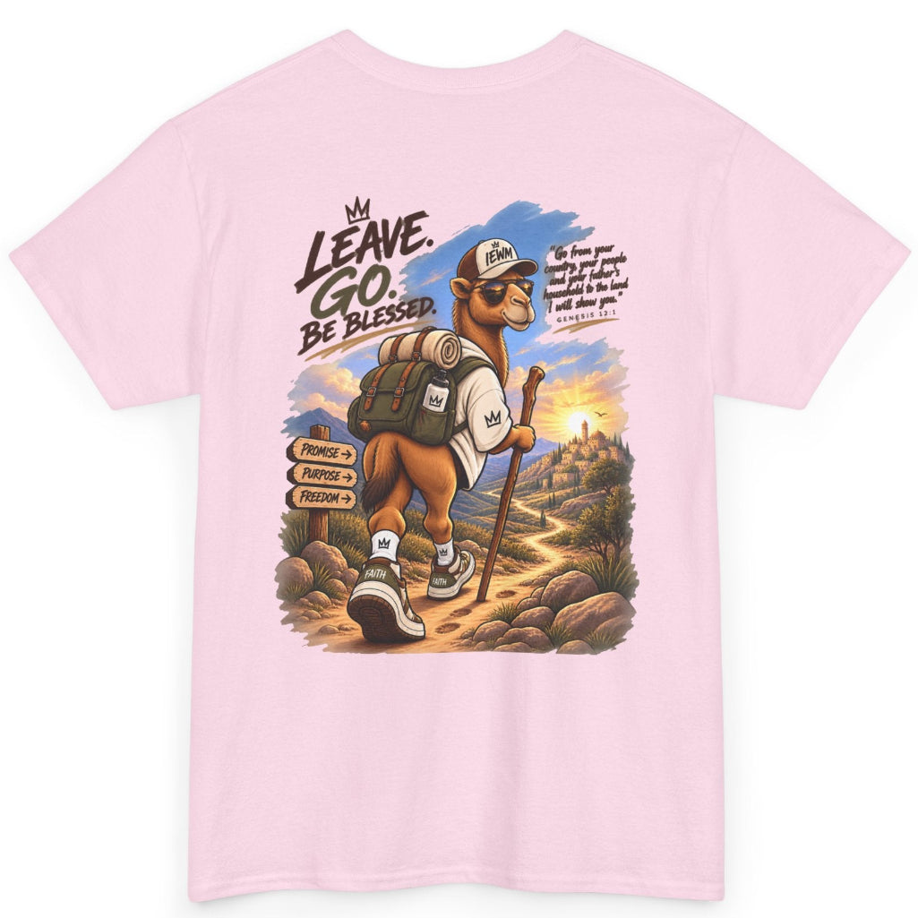 A light pink short-sleeve t-shirt with a large graphic print on the front. The graphic features a cartoon camel hiker carrying a backpack and walking stick, with the text 'LEAVE. GO. Be BLESSED'