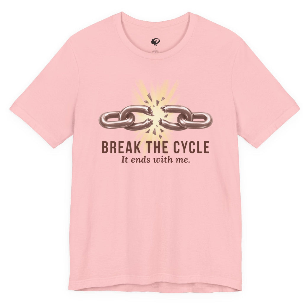A light pink short-sleeve t-shirt with a graphic on the front showing a broken chain and the text 'BREAK THE CYCLE It ends with me.' in dark brown and yellow, displayed on a clean white background.