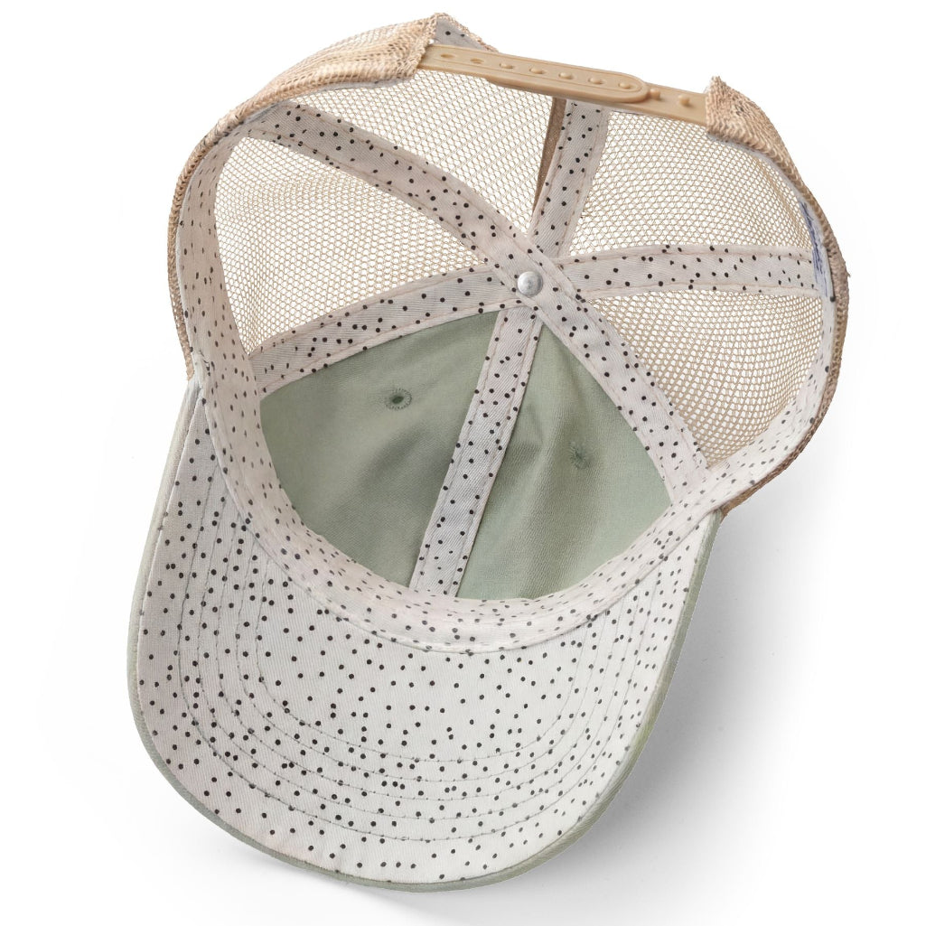 Baseball cap with mesh back and polka dot pattern on a white background