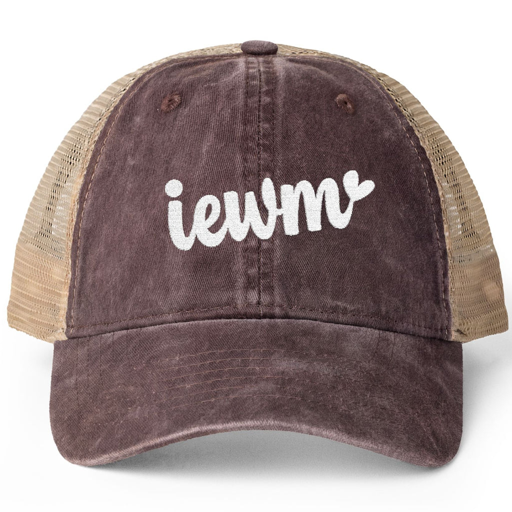 A trucker-style baseball cap with a dark brown washed front panel and brim, tan mesh side panels, and white embroidered text reading 'iewm' on the front, shown on a clean white background.