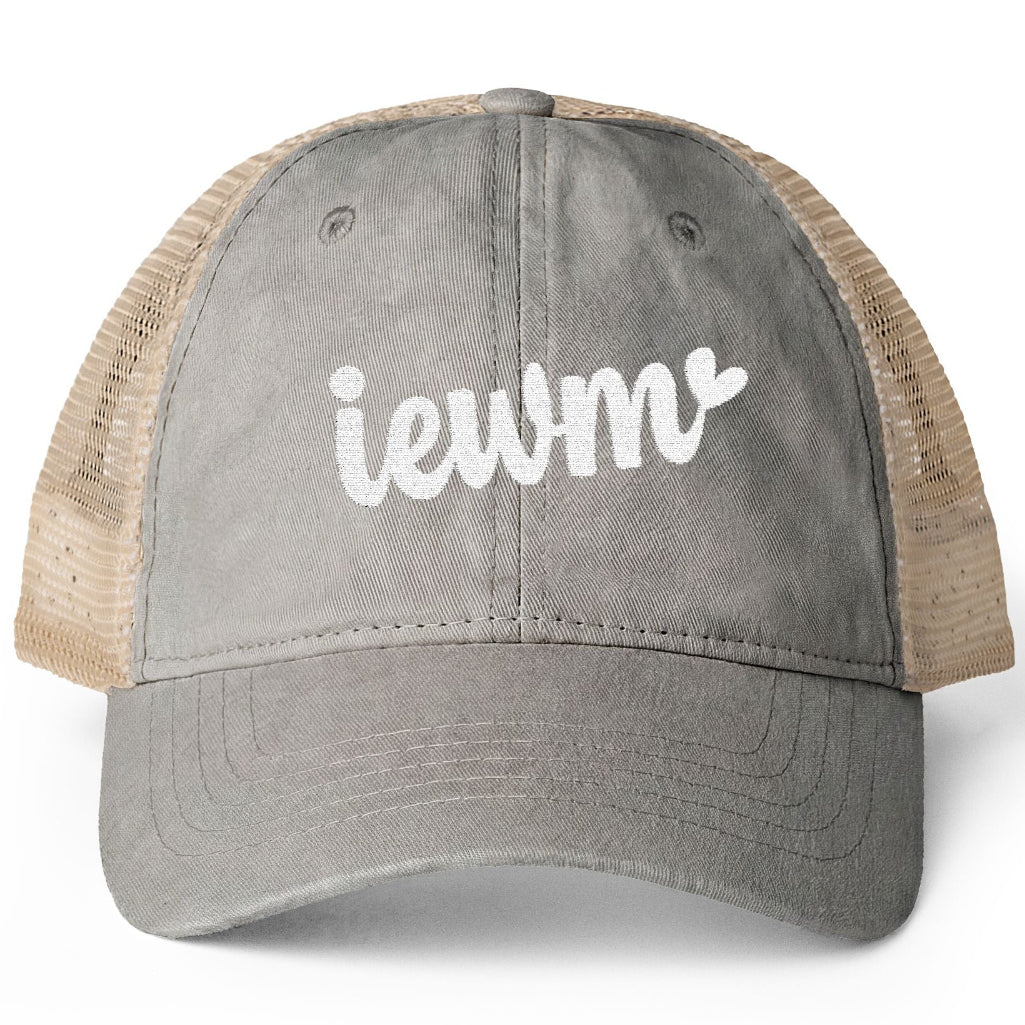 A gray washed trucker hat with beige mesh back panels and a white embroidered 'iewm' logo on the front, shown against a plain white background.