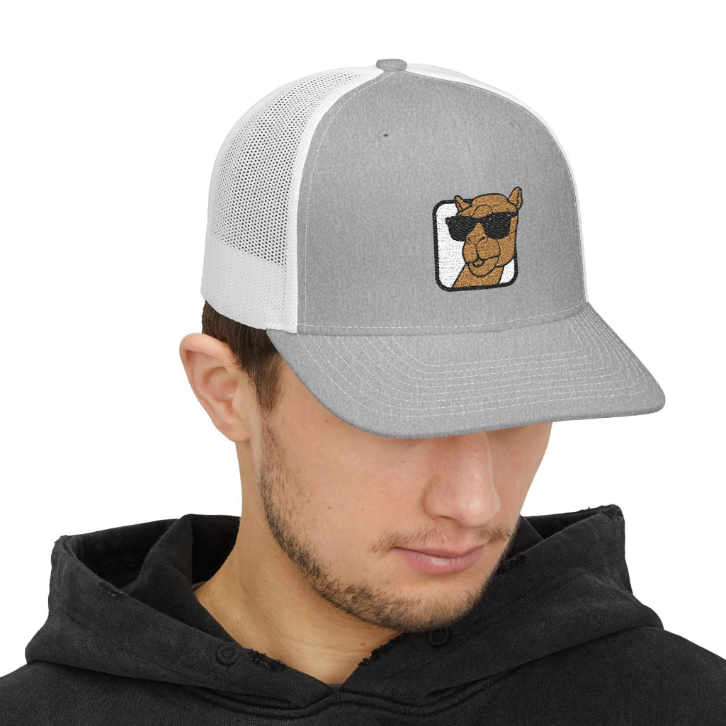 Man wearing camel logo hat on a white background 